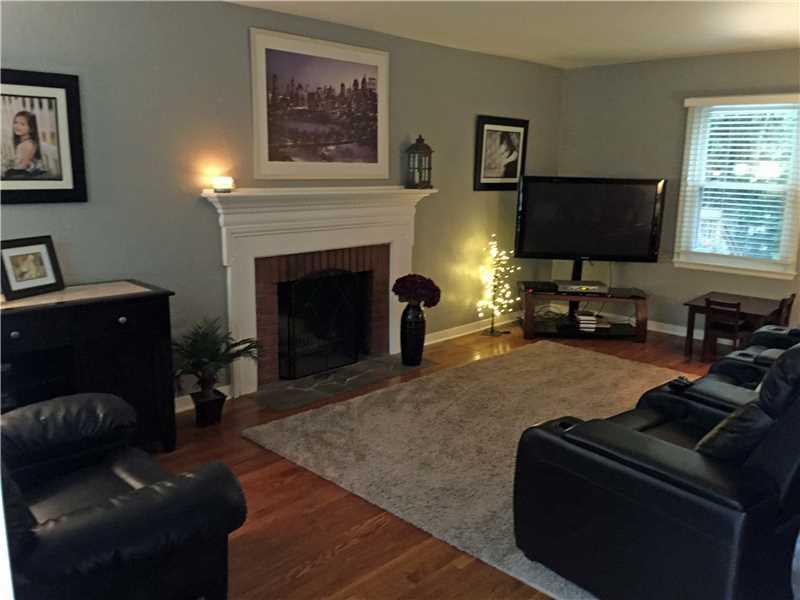 442 Patterson Road Bethel Park, PA 15102 - Photo 9 of 22 Living Room. this living room welcomes you in w a warm, cozy fireplace and lovely hardwoods throughout the entire space