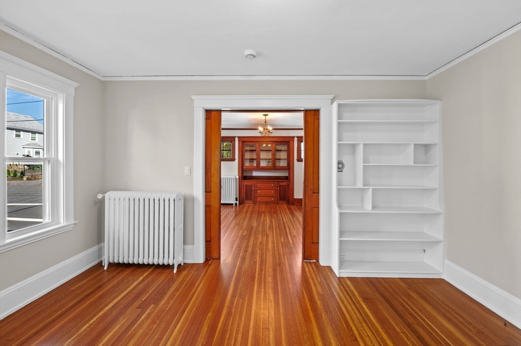 59 Butman Street, Unit 1 Beverly, MA 01915 - Photo 22 of 42 a view of a room with wooden floor and windows