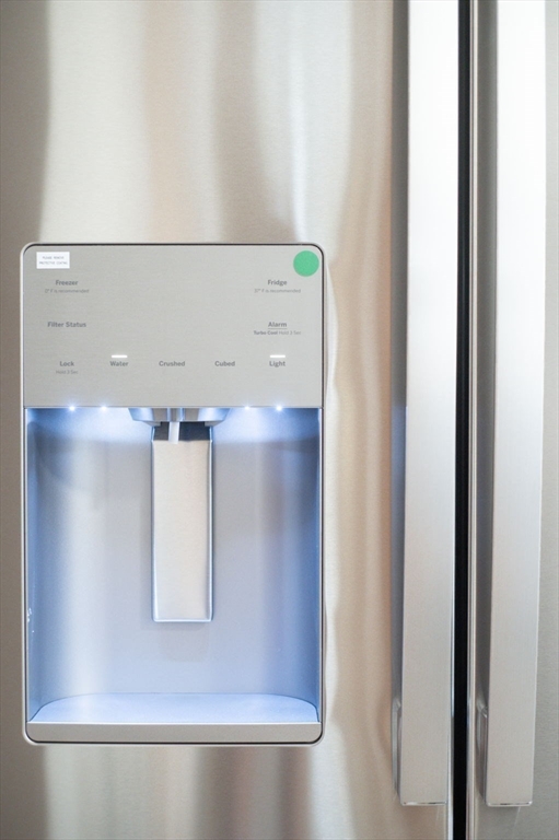 59 Butman Street, Unit 1 Beverly, MA 01915 - Photo 26 of 42 a close view of cabinet