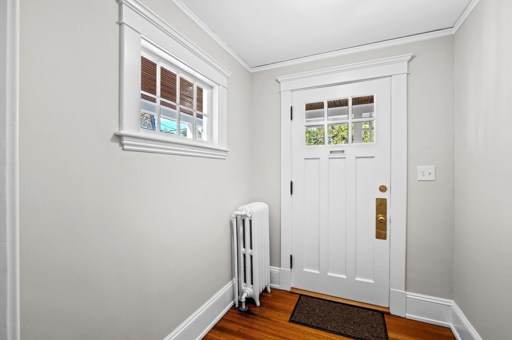 59 Butman Street, Unit 1 Beverly, MA 01915 - Photo 3 of 42 a view of an entryway with wooden floor