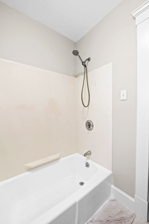 59 Butman Street, Unit 1 Beverly, MA 01915 - Photo 36 of 42 a bathroom with a bath tub and a shower