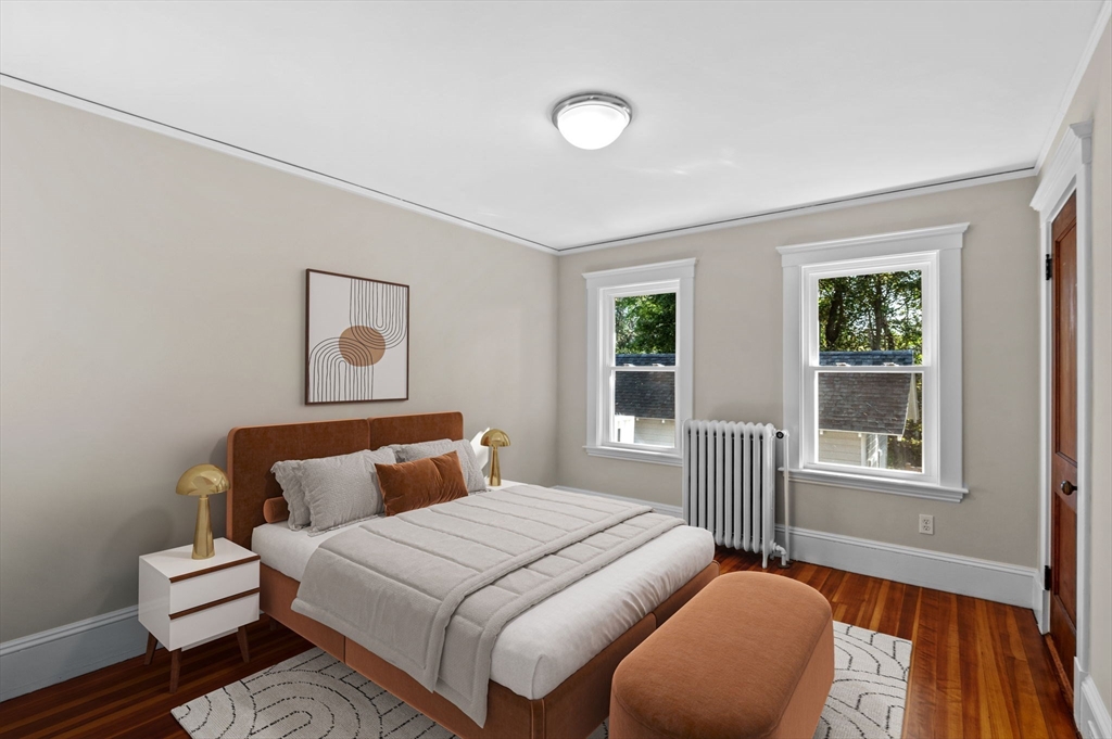 59 Butman Street, Unit 1 Beverly, MA 01915 - Photo 5 of 42 a bedroom with bed and window