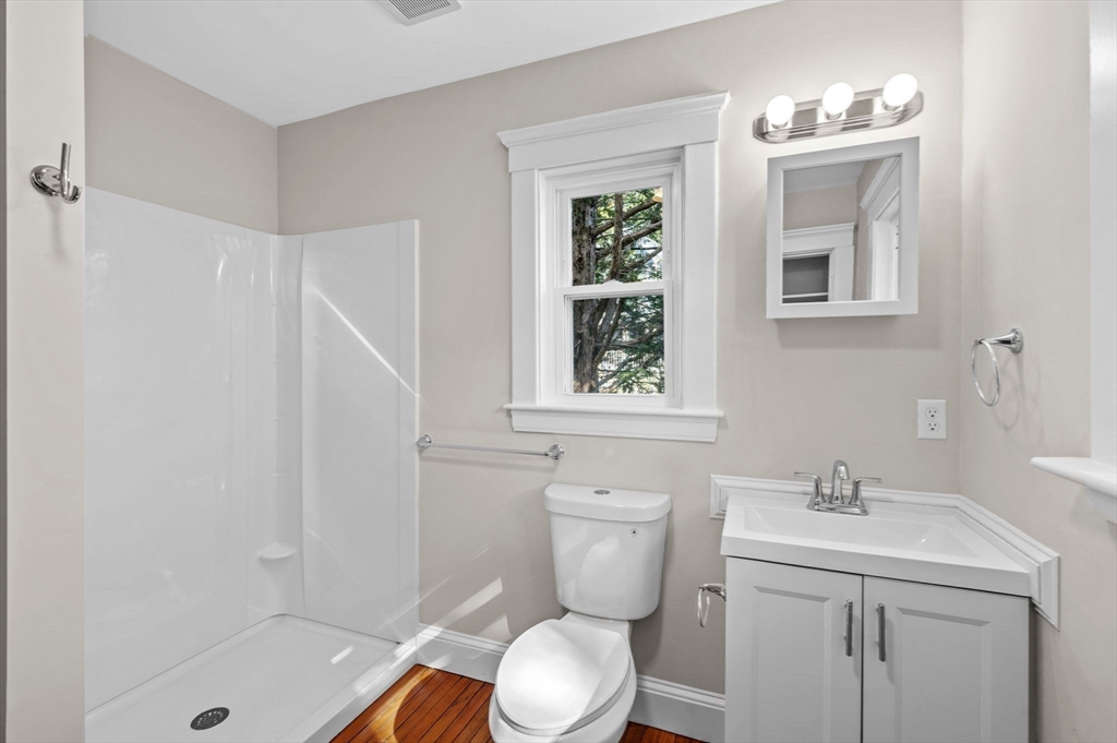 59 Butman Street, Unit 1 Beverly, MA 01915 - Photo 8 of 42 a bathroom with a sink toilet and shower
