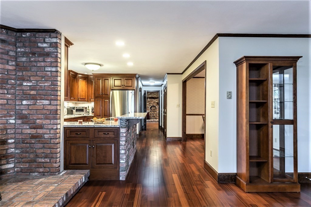 591 Neck Road Rochester, MA 02770 - Photo 11 of 32 a kitchen with stainless steel appliances granite countertop a stove and a refrigerator
