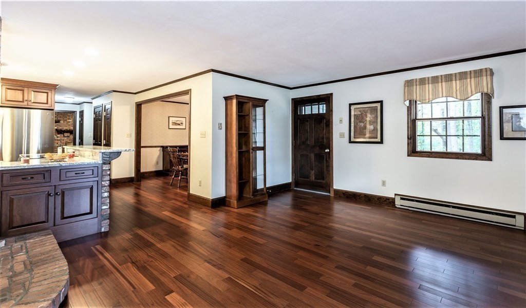 591 Neck Road Rochester, MA 02770 - Photo 12 of 32 a view of a livingroom with wooden floor and furniture