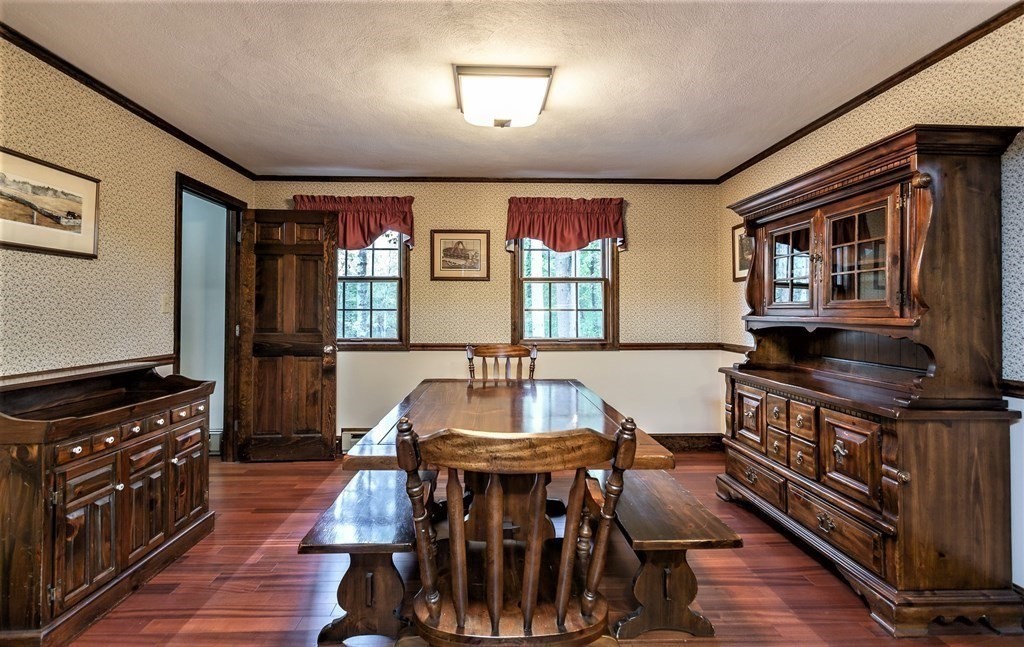 591 Neck Road Rochester, MA 02770 - Photo 13 of 32 a dining room with furniture and wooden floor