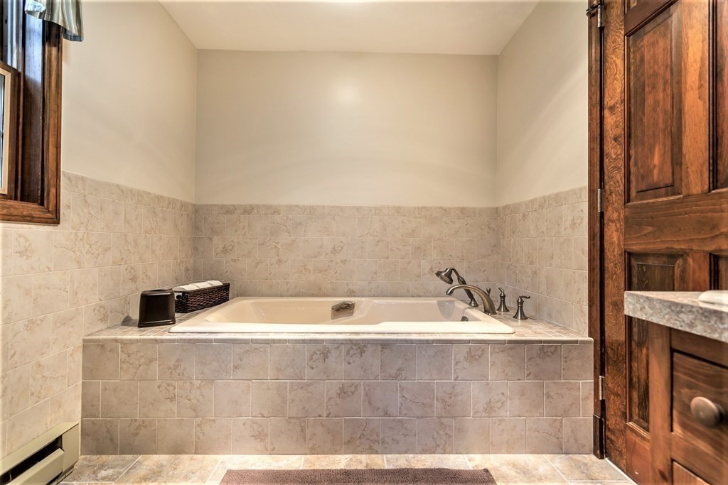 591 Neck Road Rochester, MA 02770 - Photo 23 of 32 a bathroom with a bathtub
