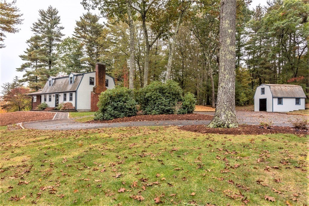 591 Neck Road Rochester, MA 02770 - Photo 29 of 32 a front view of a house with a yard