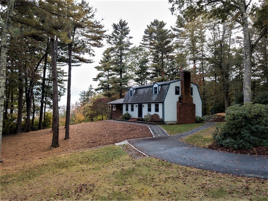 591 Neck Road Rochester, MA 02770 - Photo 7 of 32 a view of a house with a yard and large tree