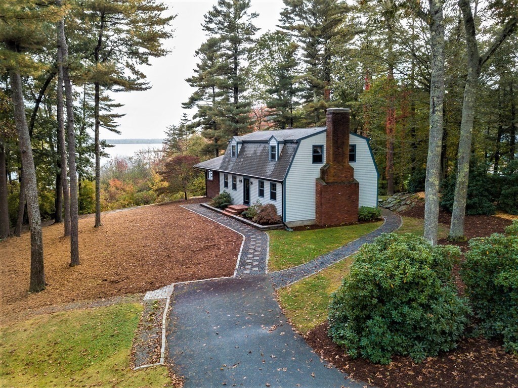 591 Neck Road Rochester, MA 02770 - Photo 9 of 32 a view of a house with backyard and trees