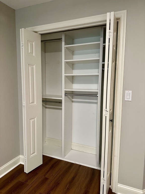 5 Mission Road, Unit 101 Chelmsford, MA 01863 - Photo 14 of 18 a view of walk in closet with wooden floor