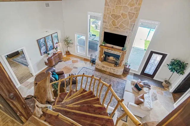 a view of a livingroom with furniture and a fireplace