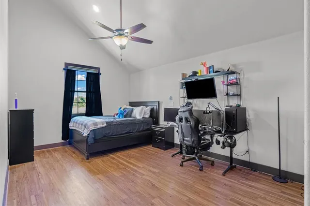 a bedroom with a workspace