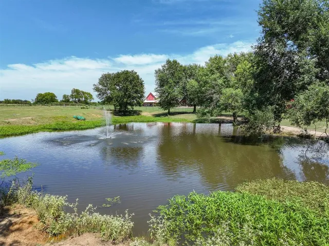 a view of a lake with a yard
