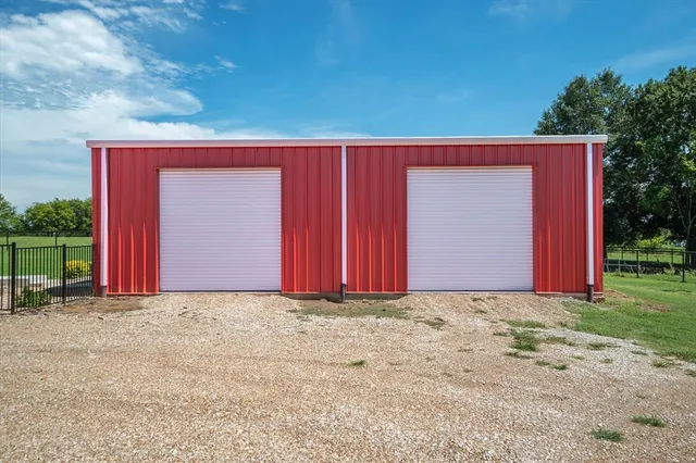 a view of wall with wooden fence