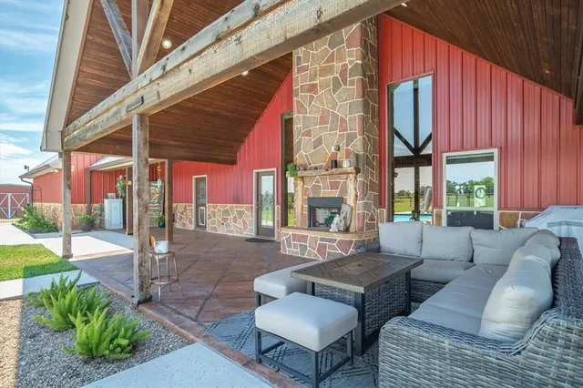 a outdoor living space with patio furniture and a potted plant