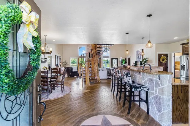 a view of a dining room with furniture window and wooden floor