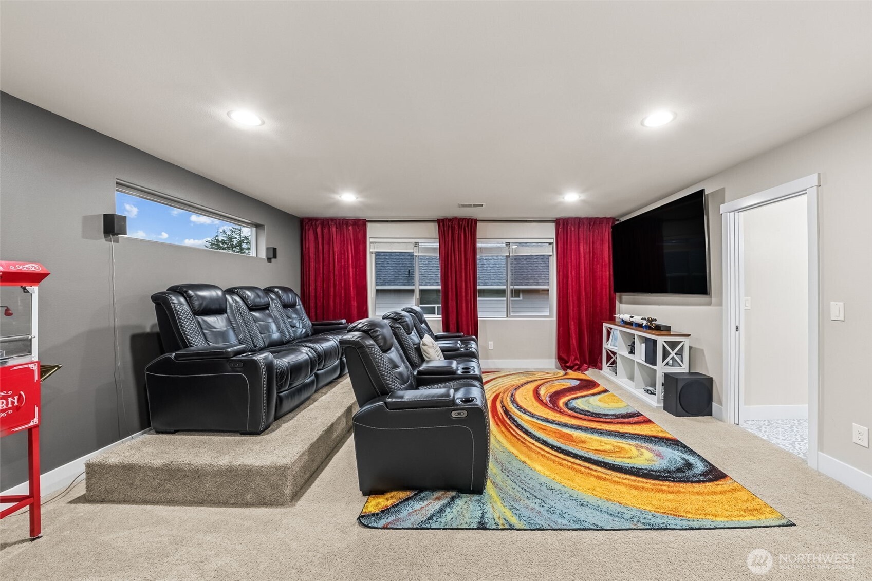 18603 134th Street East Bonney Lake, WA 98391 - Photo 17 of 39 a living room with furniture a flat screen tv and a refrigerator