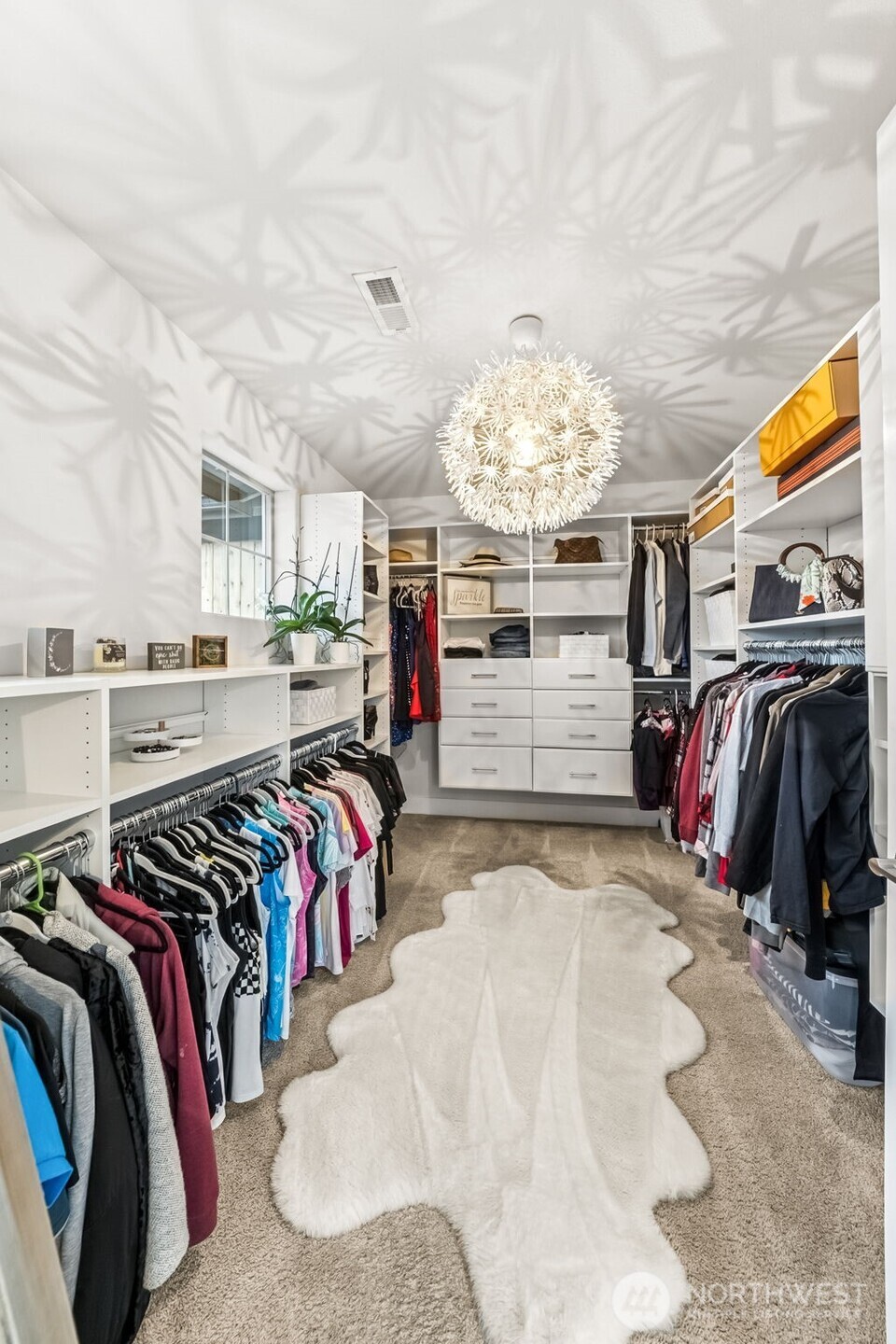 18603 134th Street East Bonney Lake, WA 98391 - Photo 22 of 39 a view of walk in closet with clothes and shoes