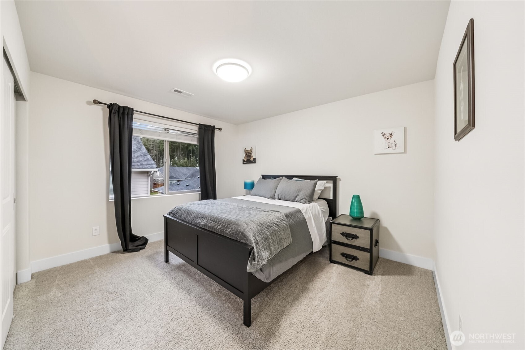 18603 134th Street East Bonney Lake, WA 98391 - Photo 27 of 39 a spacious bedroom with a bed and window