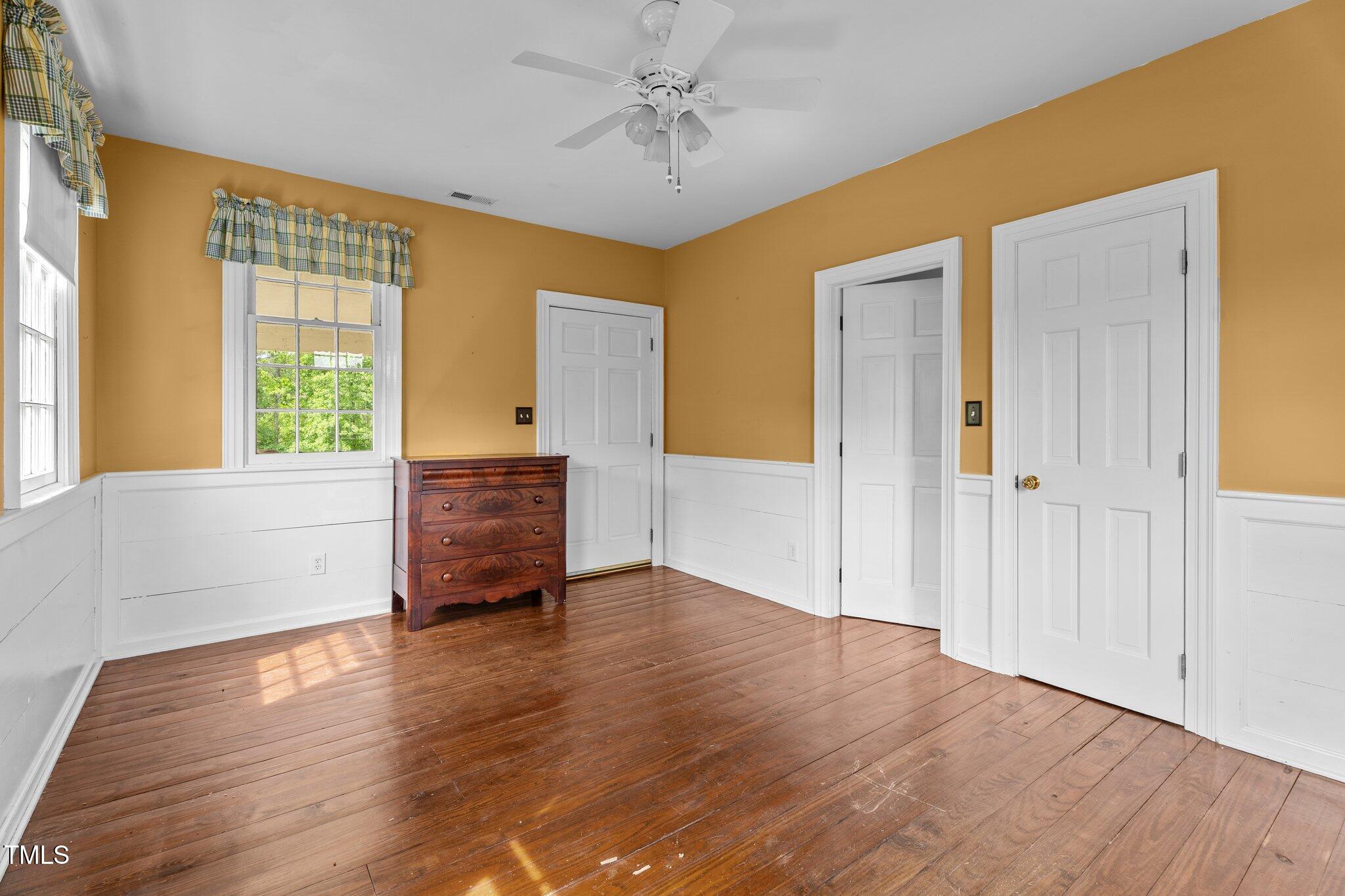 7404 Halifax Road Zebulon, NC 27597 - Photo 25 of 39 a view of an empty room with wooden floor and a window