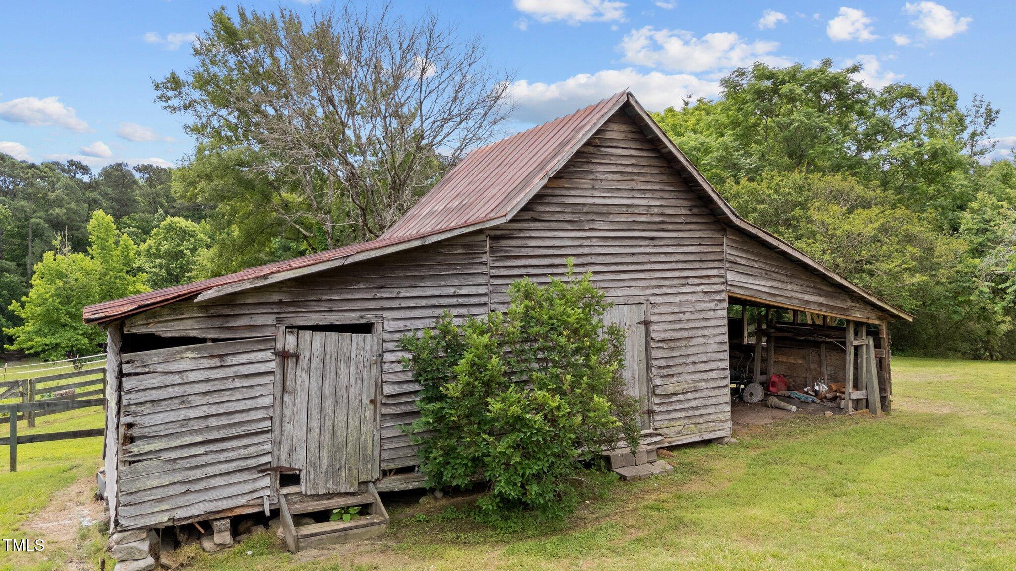 7404 Halifax Road Zebulon, NC 27597 - Photo 37 of 39 a view of a house with a yard