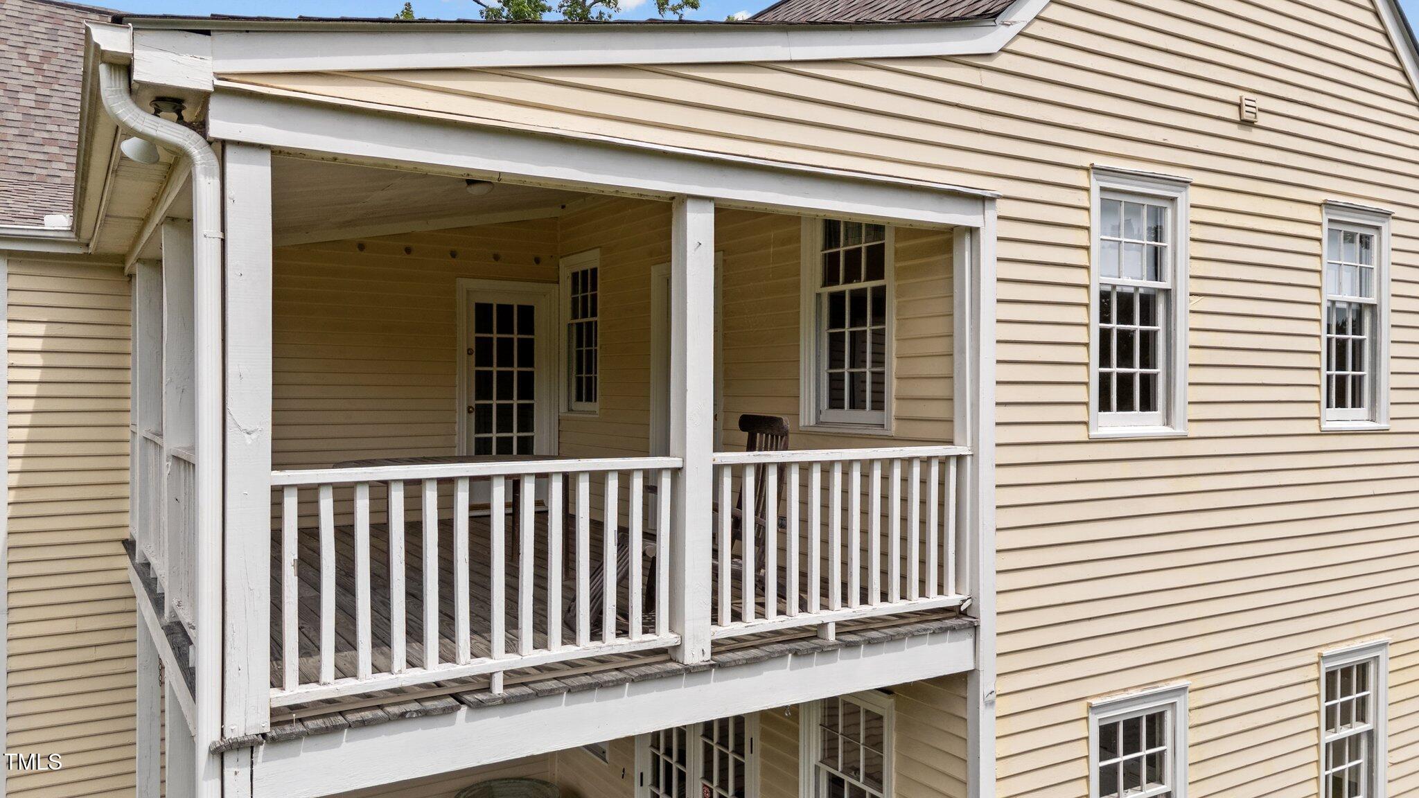 7404 Halifax Road Zebulon, NC 27597 - Photo 6 of 39 a view of a wooden balcony