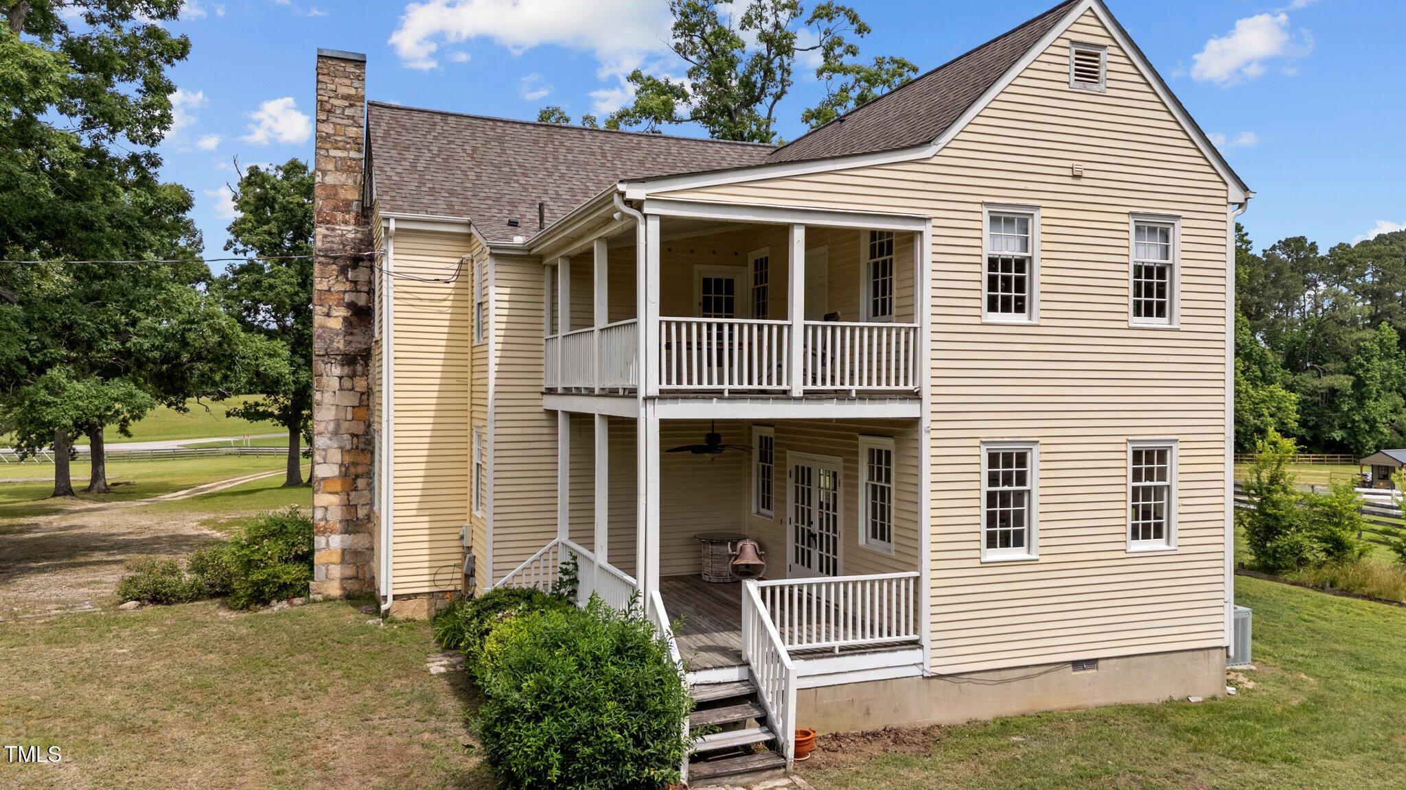 7404 Halifax Road Zebulon, NC 27597 - Photo 7 of 39 a view of house that has a window and garden