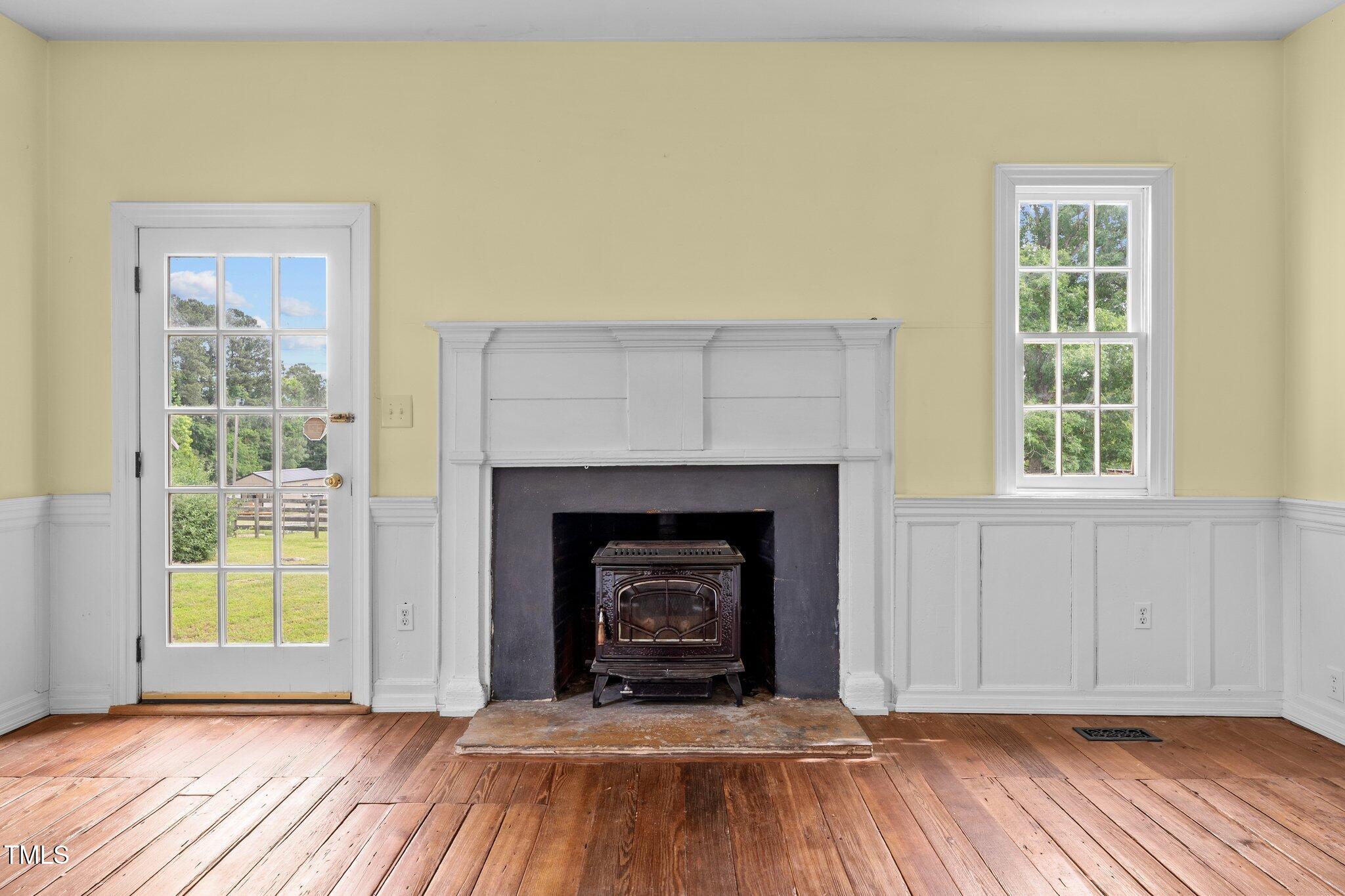 7404 Halifax Road Zebulon, NC 27597 - Photo 10 of 39 a view of an empty room with window and fire place