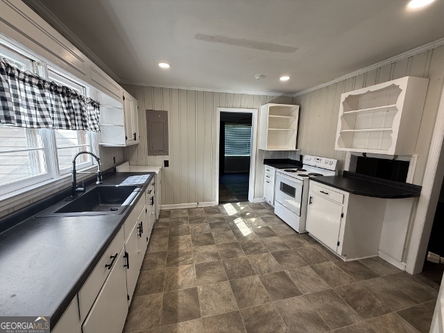 451 Lambs Bridge Road Swainsboro, GA 30401 - Photo 7 of 23 a kitchen with stainless steel appliances granite countertop a sink stove and refrigerator