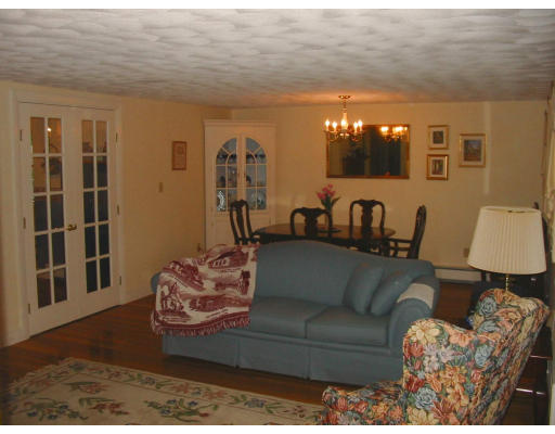 2 Anna Road Woburn, MA 01801 - Photo 3 of 6 a living room with furniture and a flat screen tv