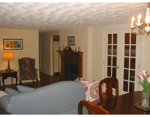 2 Anna Road Woburn, MA 01801 - Photo 4 of 6 a bedroom with a bed and wooden floor