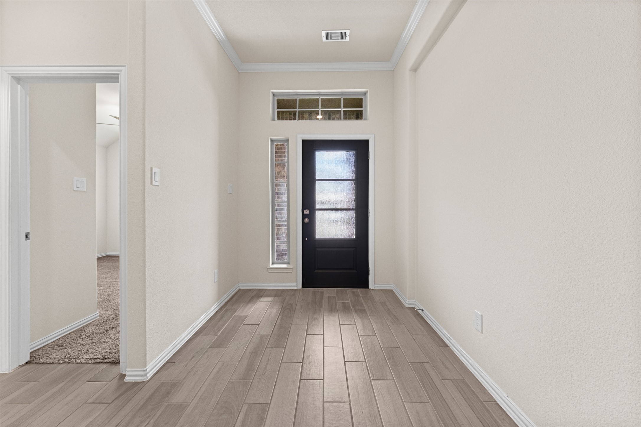 4331 Tawny Timber Drive Spring, TX 77386 - Photo 4 of 49 Light and bright entrance with transom windows and crown molding.