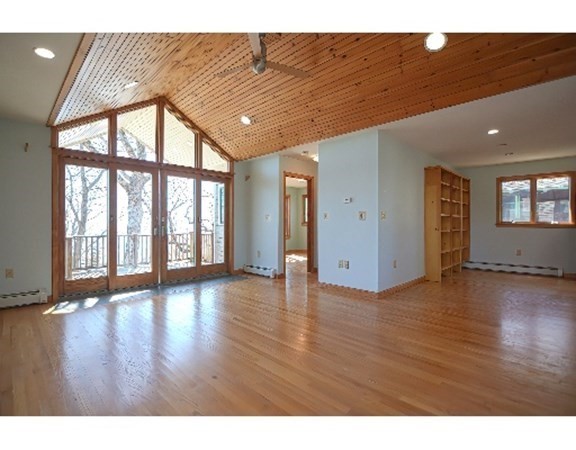 55 Lookout Point Road Plymouth, MA 02360 - Photo 11 of 42 a view of an empty room with wooden floor and a window