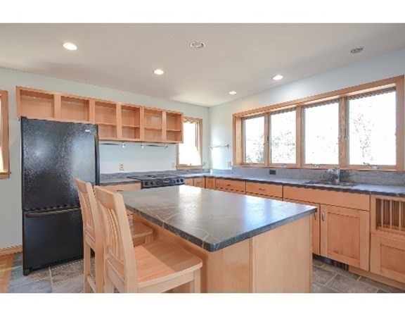 55 Lookout Point Road Plymouth, MA 02360 - Photo 16 of 42 a kitchen with stainless steel appliances granite countertop a sink a stove and a refrigerator