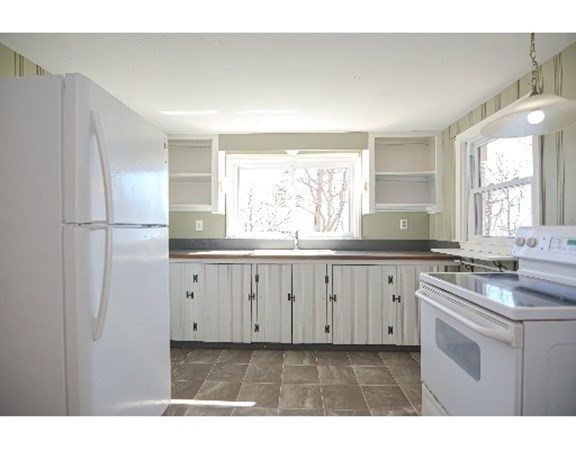 55 Lookout Point Road Plymouth, MA 02360 - Photo 24 of 42 a kitchen with cabinets appliances a window and a sink