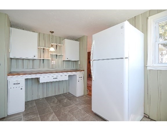 55 Lookout Point Road Plymouth, MA 02360 - Photo 25 of 42 a kitchen with a refrigerator sink stove and cabinets