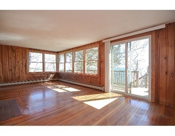 55 Lookout Point Road Plymouth, MA 02360 - Photo 27 of 42 a view of an empty room with wooden floor and a window