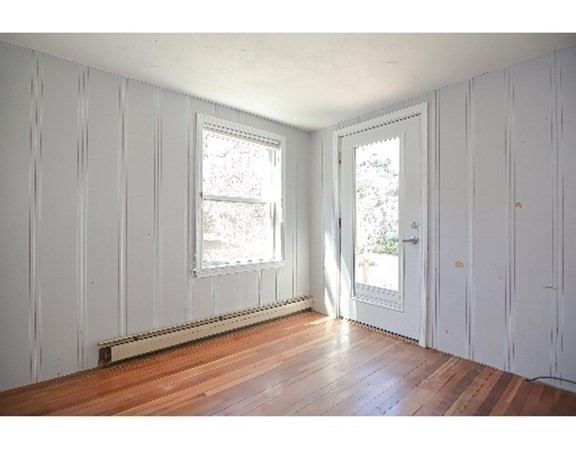55 Lookout Point Road Plymouth, MA 02360 - Photo 36 of 42 a view of an empty room with wooden floor and a window
