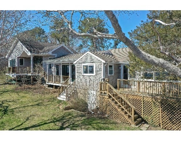 55 Lookout Point Road Plymouth, MA 02360 - Photo 7 of 42 a front view of a house with a garden