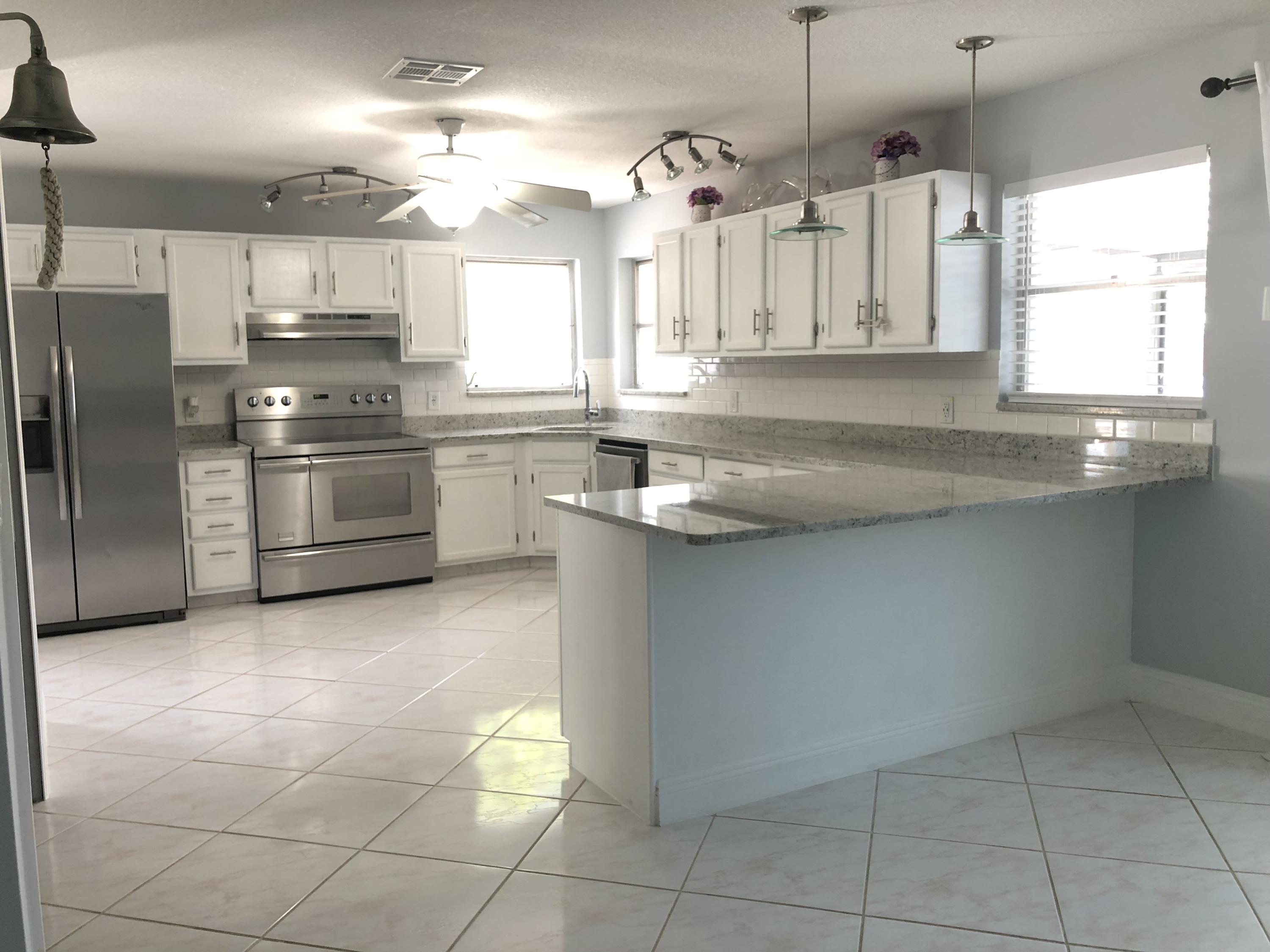 2473 Southwest Murphy Road Palm City, FL 34990 - Photo 3 of 28 2F8BCC1F-349A-4BAF-94E0-FC64AE3CE363