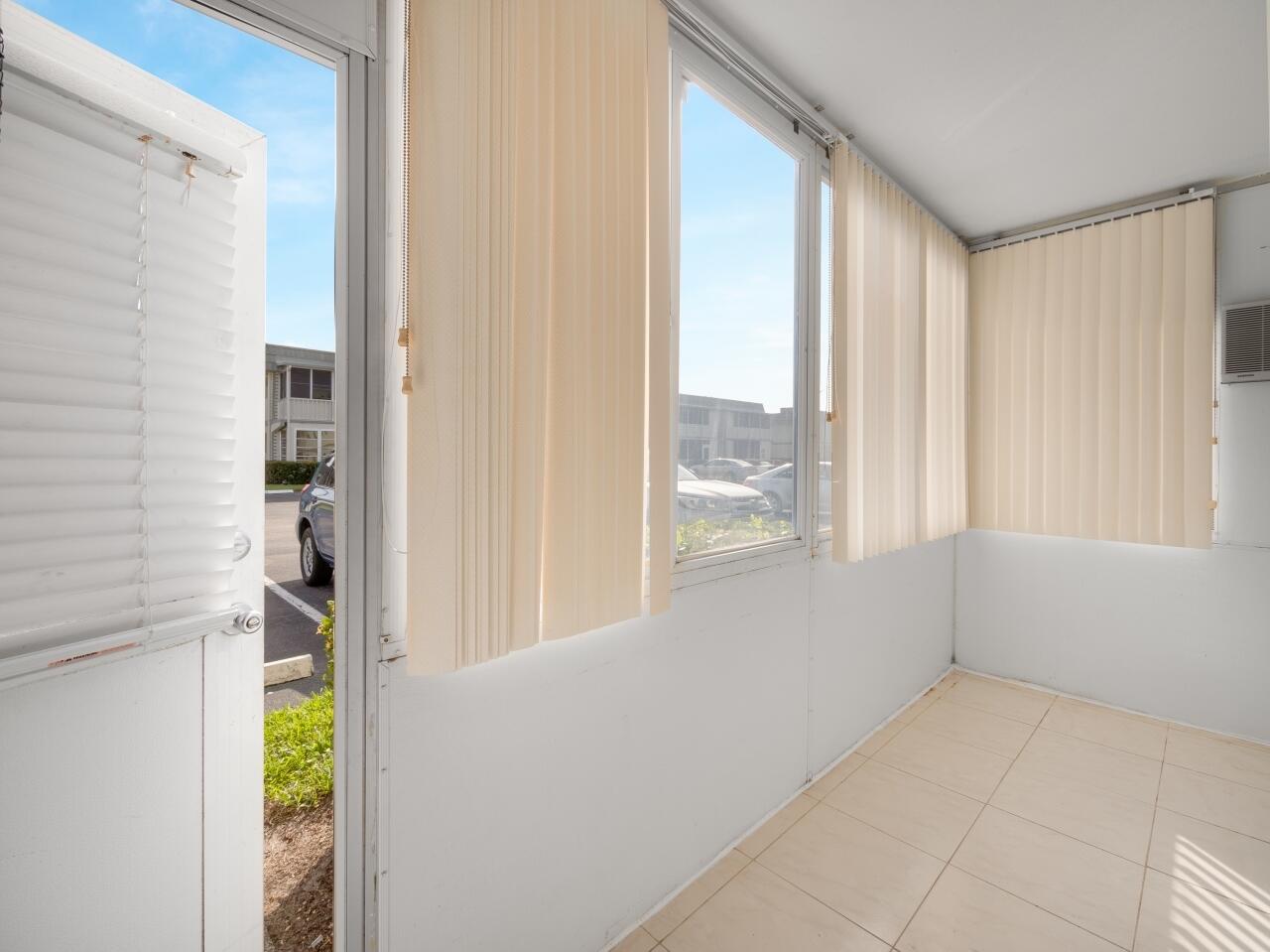438 Monaco J Delray Beach, FL 33446 - Photo 2 of 15 a view of an empty room with window