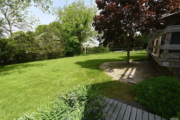 an aerial view of a house with yard swimming pool and outdoor seating
