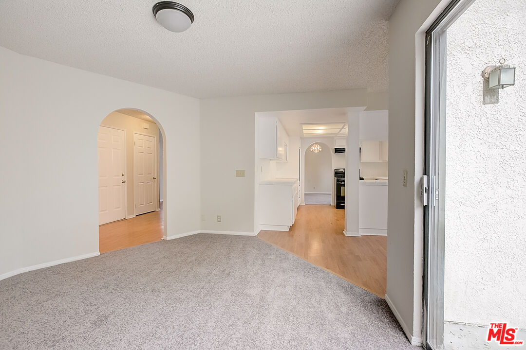 2535 West Ave K9 Lancaster, CA 93536 - Photo 16 of 35 a view of empty room with wooden floor