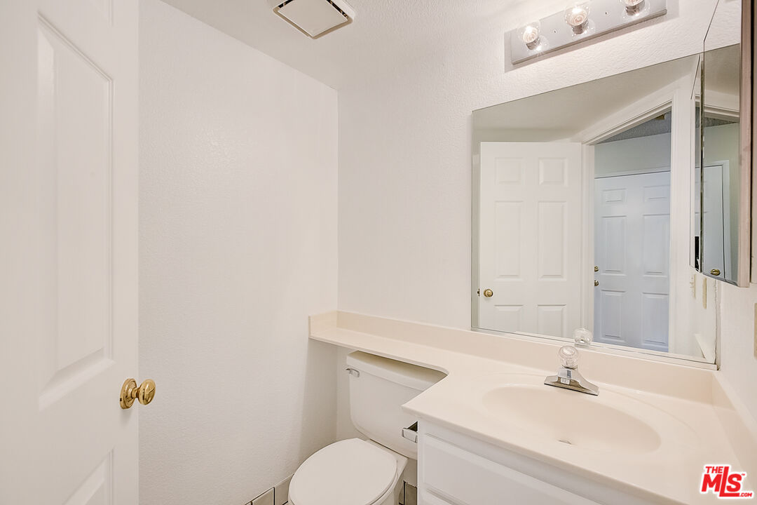 2535 West Ave K9 Lancaster, CA 93536 - Photo 26 of 35 a bathroom with a sink toilet and shower