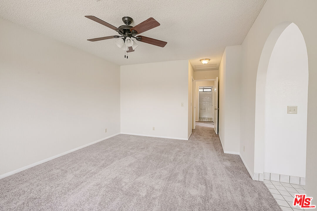 2535 West Ave K9 Lancaster, CA 93536 - Photo 33 of 35 a view of an empty room and a ceiling fan