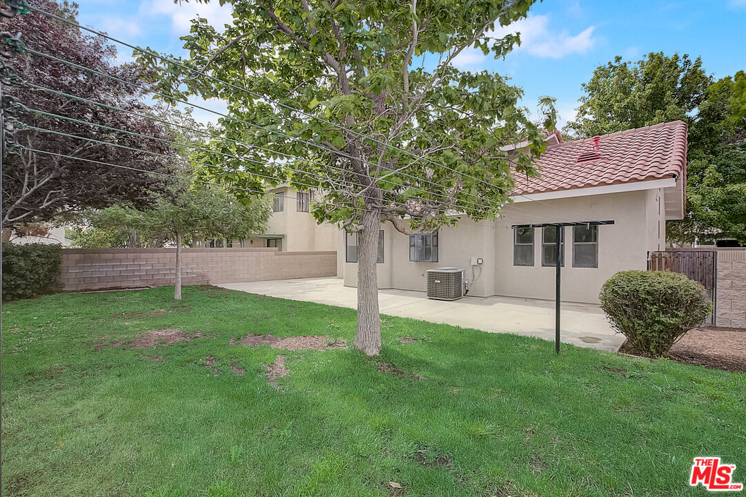 2535 West Ave K9 Lancaster, CA 93536 - Photo 35 of 35 a view of a house with backyard and a tree