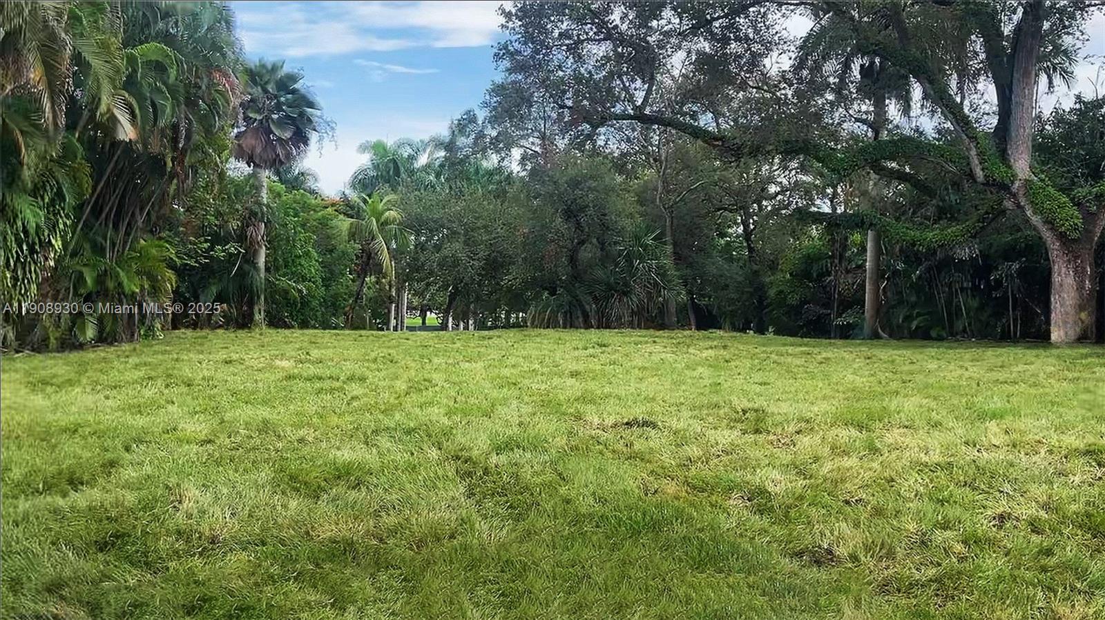 a view of house with backyard