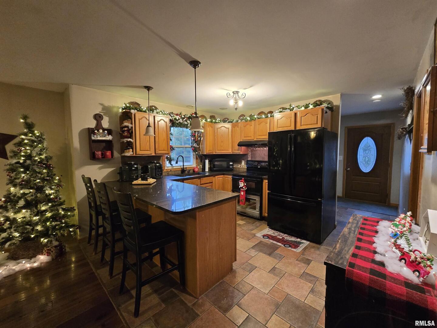11882 Goshen Meadows Mount Vernon, IL 62864 - Photo 25 of 52 a kitchen with a table and chairs in it