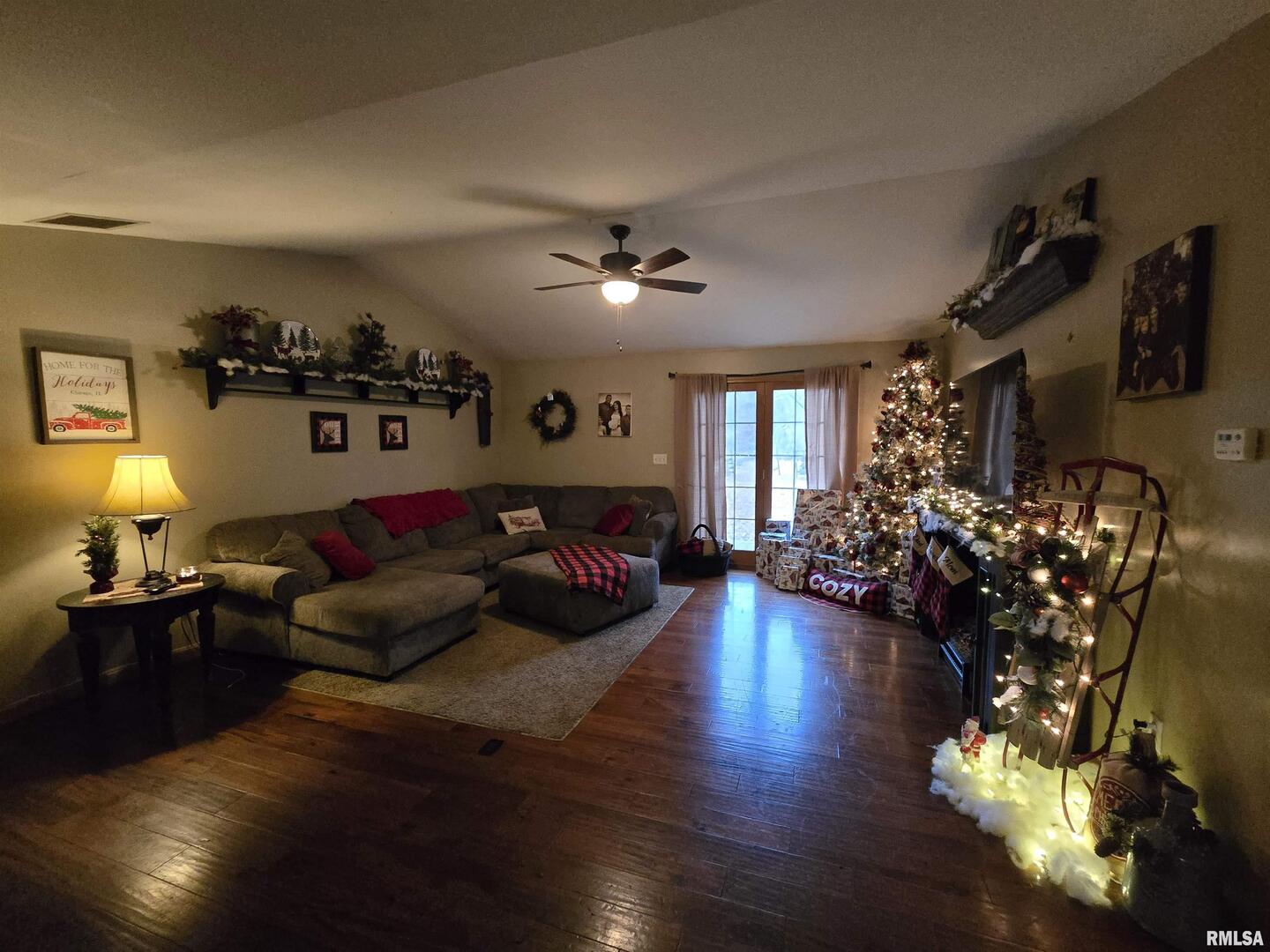 11882 Goshen Meadows Mount Vernon, IL 62864 - Photo 31 of 52 a living room with furniture flowers and a fireplace